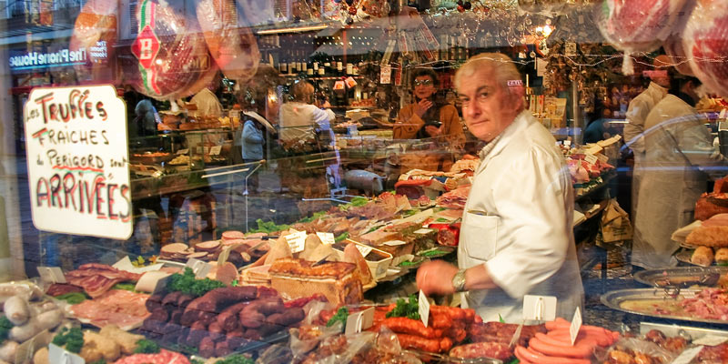 A butcher in the window of Davoli, the pork specialists, photo by Mark Craft