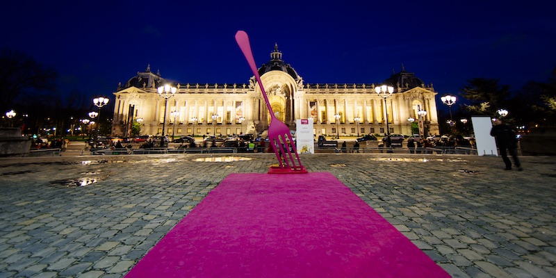 A purple carpet unrolled at the Petit Palais with a giant fork stuck in it, celebrating the Taste of Paris event