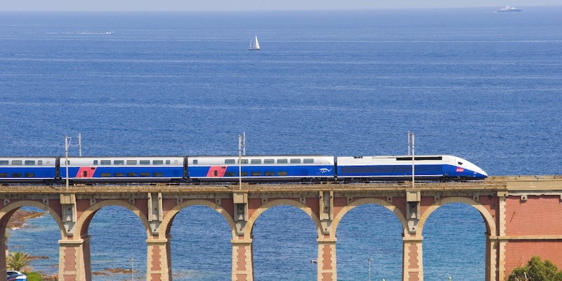 A French high-speed train zips along the Mediterranean coast