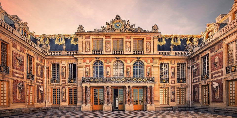 The grand entry of the Chateau de Versailles at sunset
