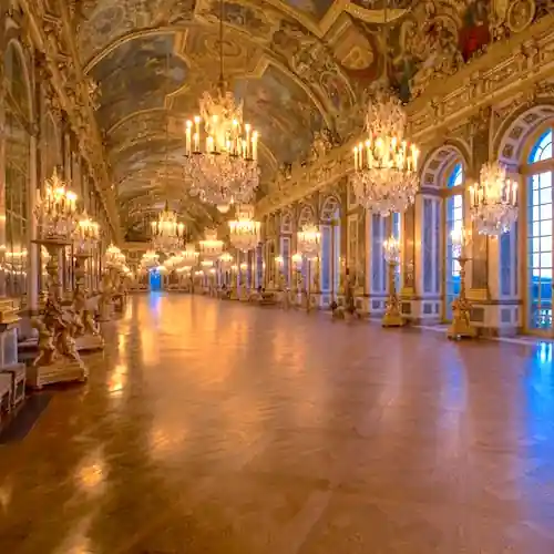 Hall of Mirrors at the Palace of Versailles with chandeliers and gilded ceilings
