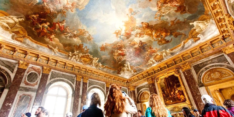 A magnificent ceiling viewed by visitors during a  Versailles Half-Day Small-Group Tour