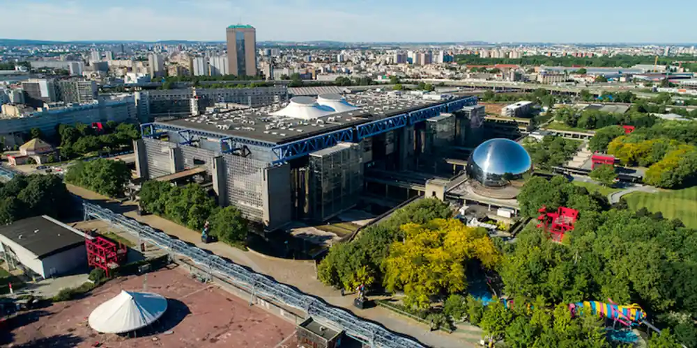 erial view of Parc de la Villette with the Cité des Sciences, Géode, gardens, and red folies