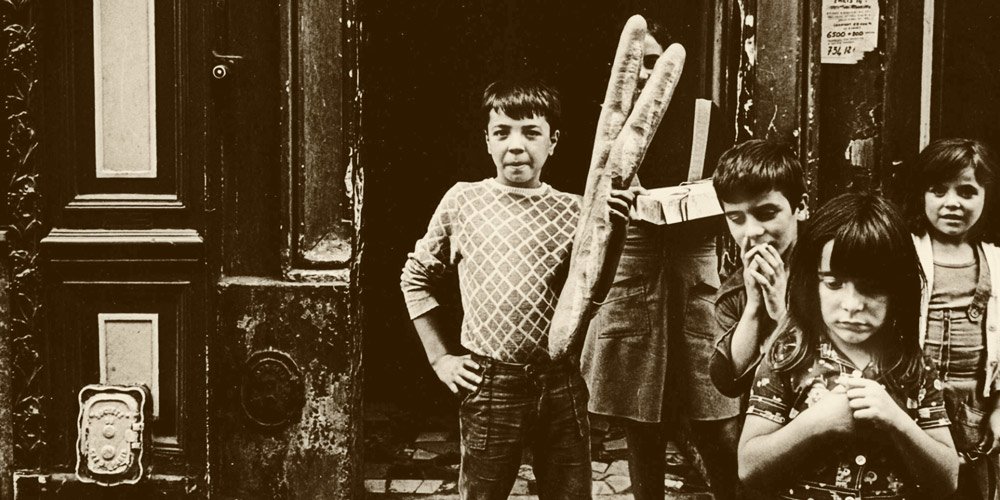 Vintage photo of Paris children with baguettes